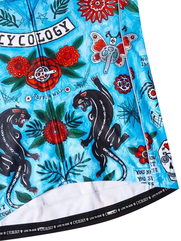 Vibrant blue cycling jersey with bold panther, floral, and gear designs for men and women riders