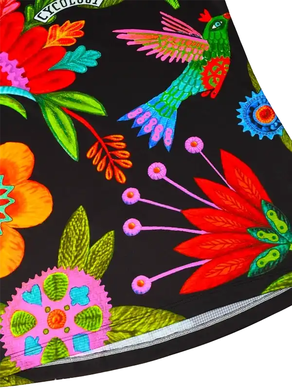 Vibrant floral and hummingbird print on black cycling shorts with zipper pocket