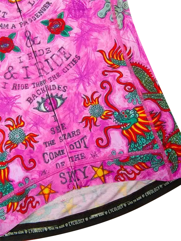 Pink cycling jersey with dragon, roses, and 'I ride' text, featuring bold graphics and performance fabric.