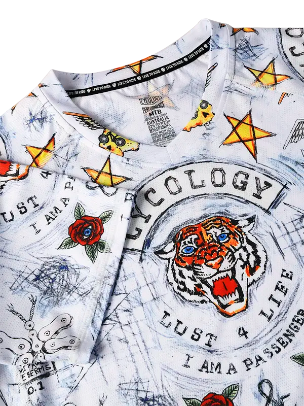 City of Angels White Women's Short Sleeve MTB Jersey with colorful graphics and text including a tiger design and various symbols.