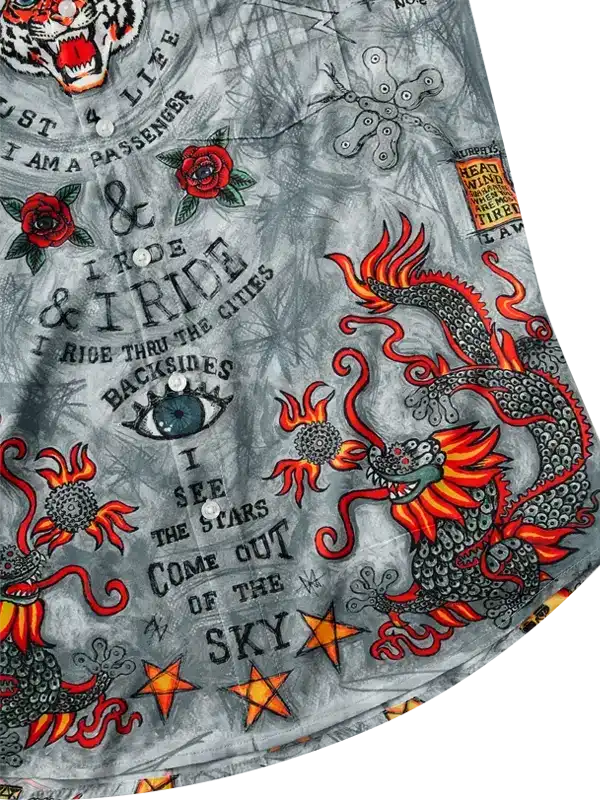 Men's cycling shirt with dragon, roses, and tattoo-style graphics on gray fabric