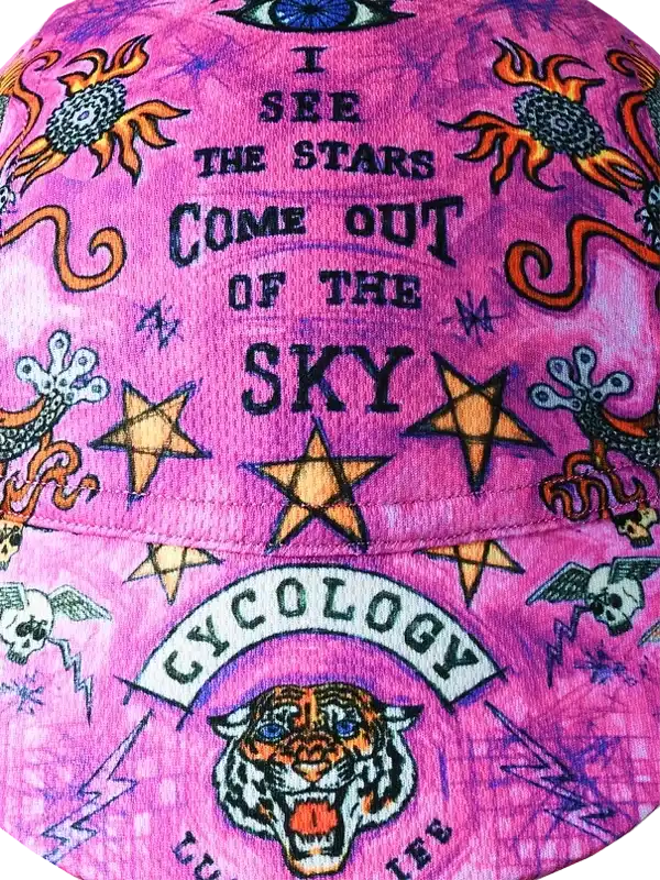Pink cycling cap with 'I see the stars come out of the sky' text, stars, tiger, and Cycology logo
