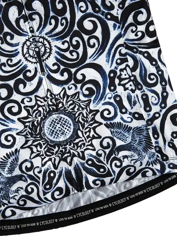 Black and white cycling jersey with intricate swirls, sunflower, and bird design, featuring 'LIVE TO RIDE' hem text