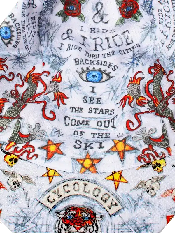 Cycling jersey with bold tattoo-style graphics, stars, skulls, and 'I Ride' text on white fabric