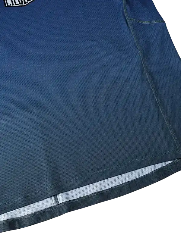 Navy blue cycling jersey with reflective hem and breathable fabric detail