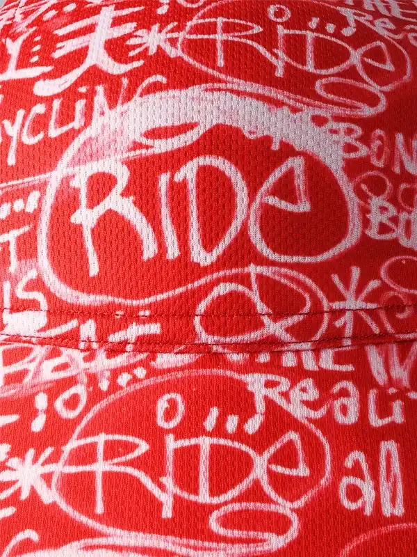 Red cycling jersey with bold white 'RIDE' graffiti print, ideal for men's and women's bike apparel.