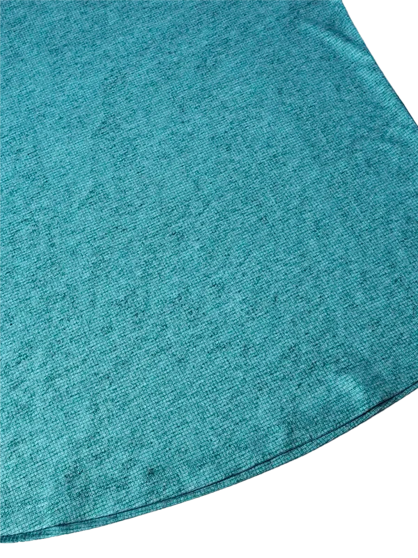 Teal heathered cycling jersey fabric close-up, soft breathable material for performance rides