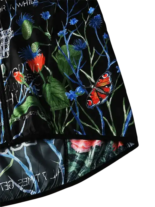 Black cycling jersey with vibrant floral and butterfly print, featuring red and blue flowers, green leaves, and a detailed butterfly design.