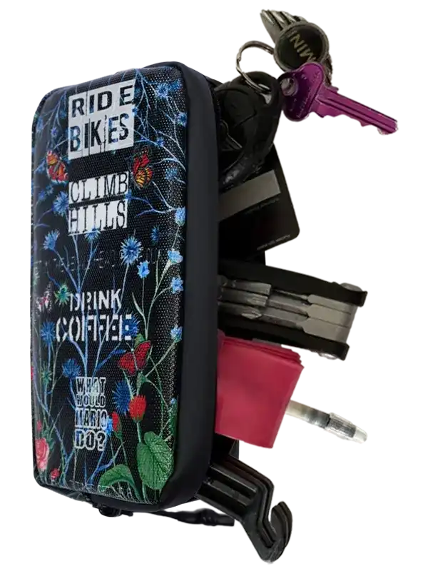 Floral-patterned cycling key organizer with tools and keys, perfect for bike riders