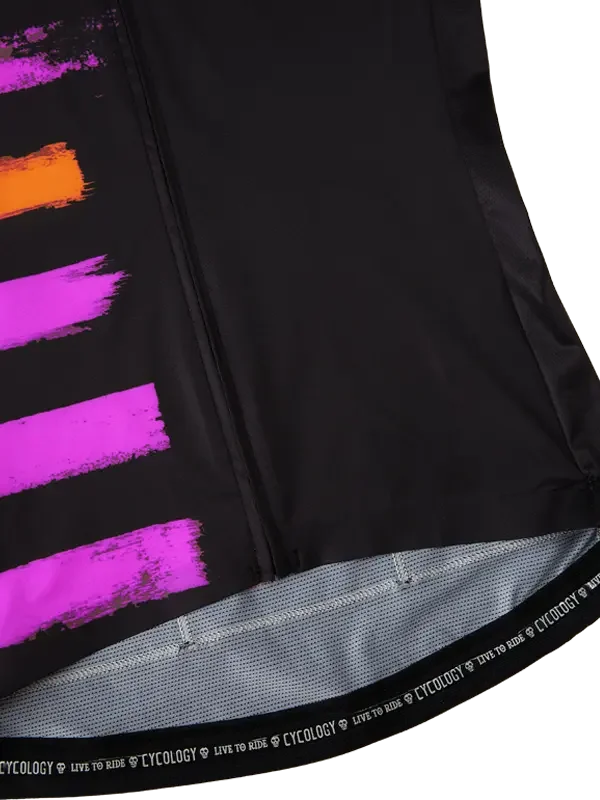 Black cycling jersey with vibrant pink and orange brushstroke design, featuring 'LIVE TO RIDE' hem detail
