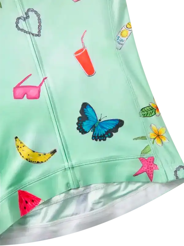 Mint green cycling jersey with butterfly, banana, sunglasses, and tropical print design for women's bike wear