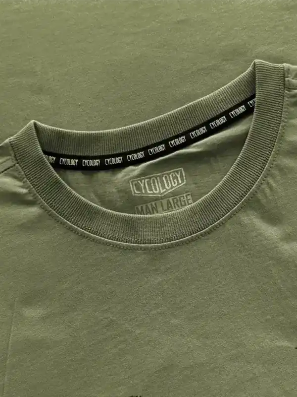 Olive green men's cycling t-shirt with branded neck tape and size label, made from high-quality fabric.