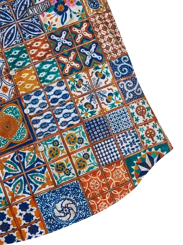 Colorful patchwork cycling shirt with tile-inspired patterns and floral designs