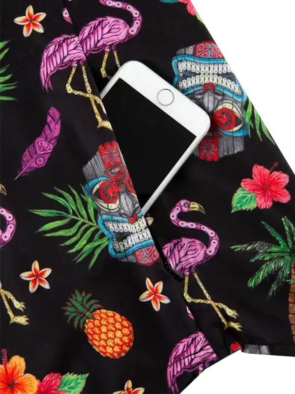 Tropical flamingo print cycling shorts with pineapple, hibiscus, and tiki mask design, phone pocket detail