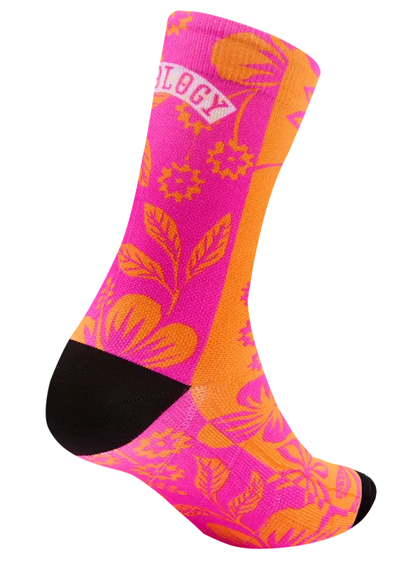 Colorful sock with pink floral pattern on an orange background