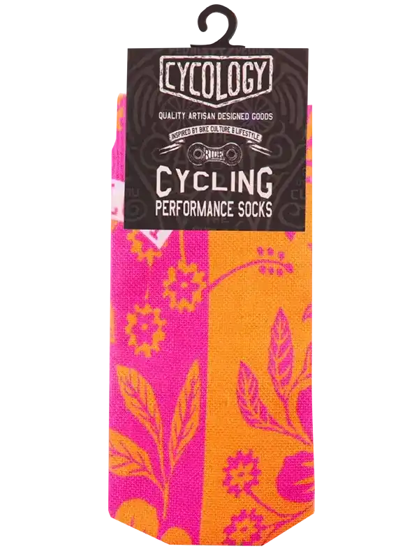Cycling performance socks with vibrant floral print in pink and orange, designed for bike culture