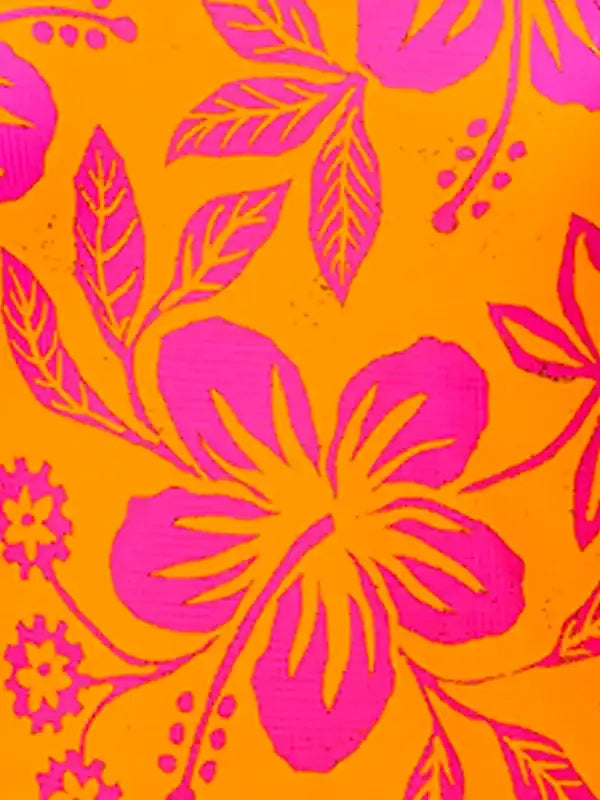 Vibrant pink hibiscus floral print on orange cycling fabric, ideal for women's bike apparel