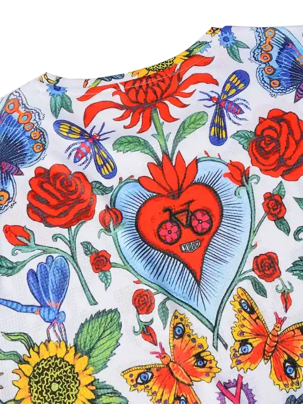 Vibrant floral and butterfly print cycling jersey with heart and bike design