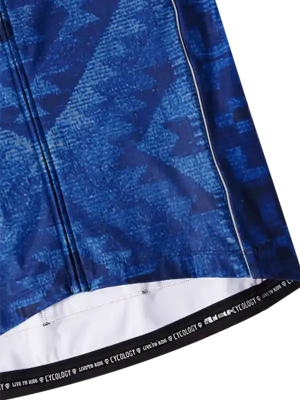 Blue patterned cycling jersey with white hem and branded waistband, designed for men's and women's rides.