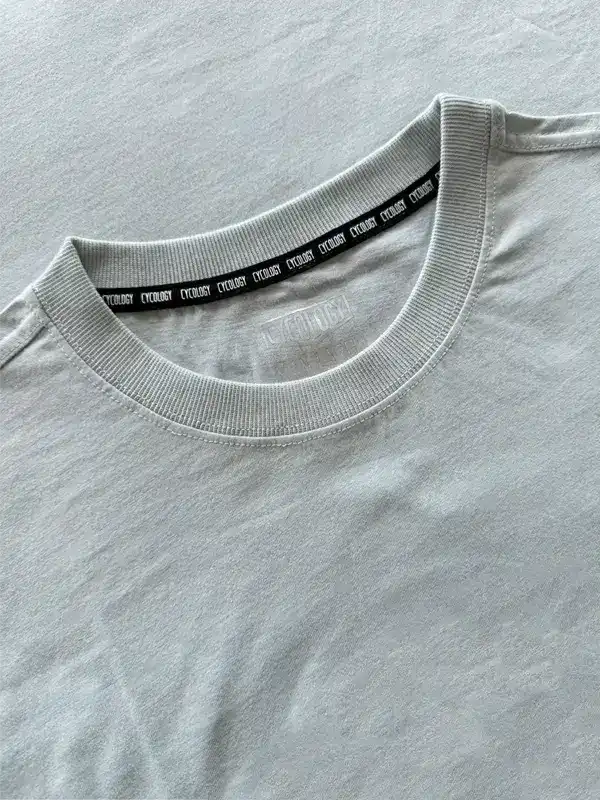 Light gray cycling t-shirt with branded neck tape, soft fabric detail for active wear