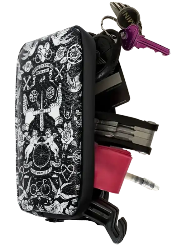 Black and white tattoo-style cycling accessory pouch with keys, tools, and multi-tool