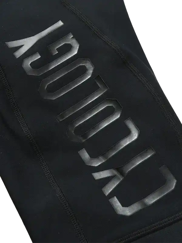Black cycling apparel with bold 'CYCOLOGY' logo, high-quality fabric detail