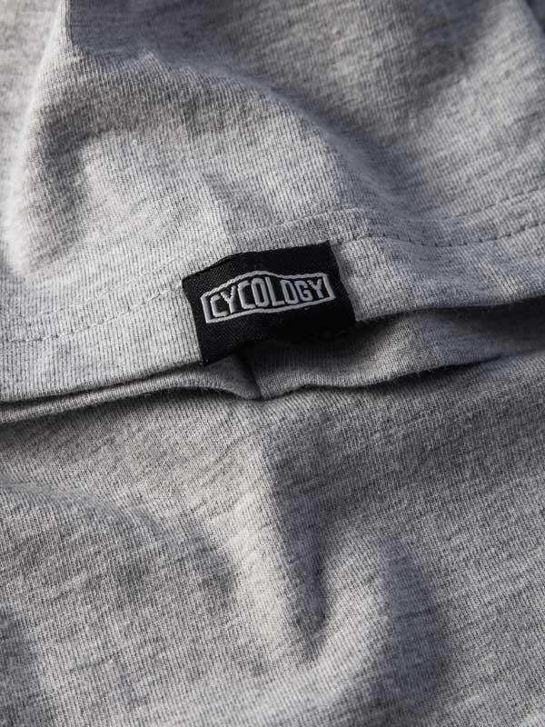 Cycology brand tag on gray cycling apparel fabric