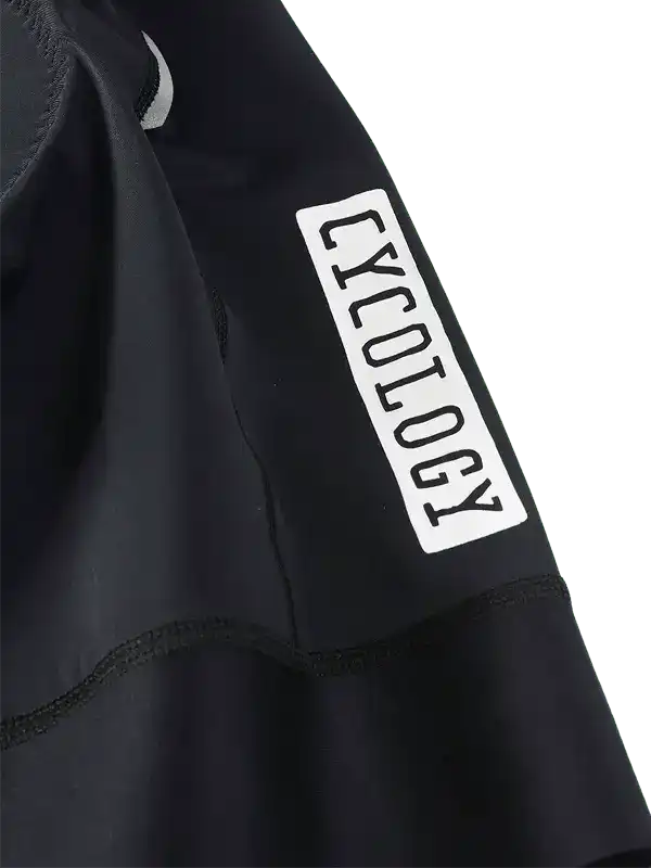Black cycling jersey sleeve with white Cycology logo, high-quality fabric detail for men's and women's bike wear