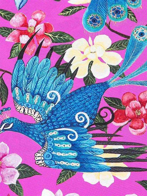 Vibrant blue peacock and floral print on pink cycling apparel fabric