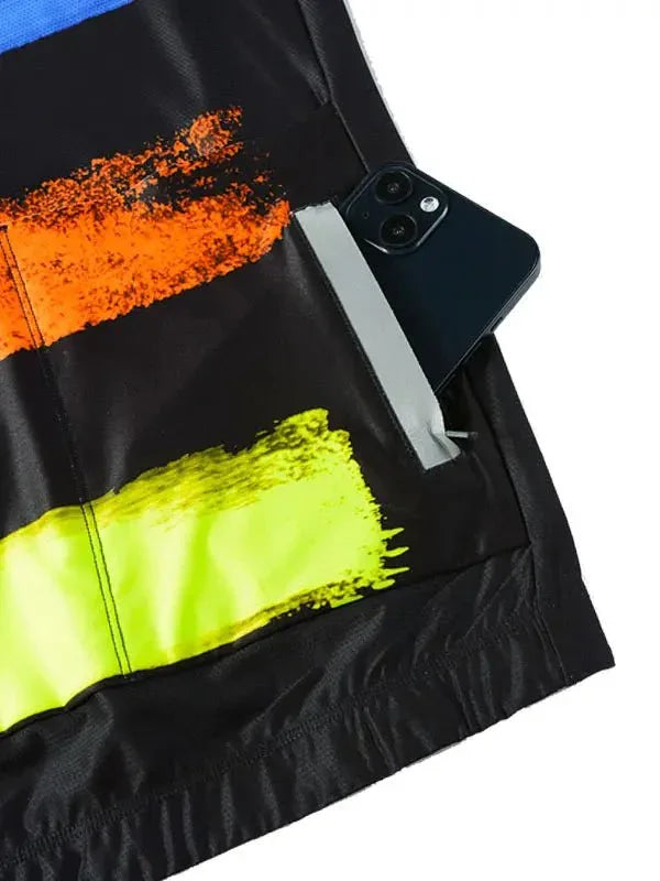 Black cycling jersey with neon orange and yellow paint-stroke design, phone in back pocket