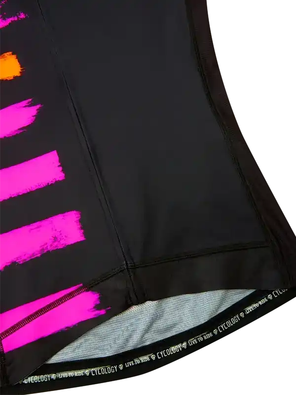 Black cycling jersey with bold pink and orange brushstroke design, featuring 'CYCOLOGY LIVE TO RIDE' hem detail