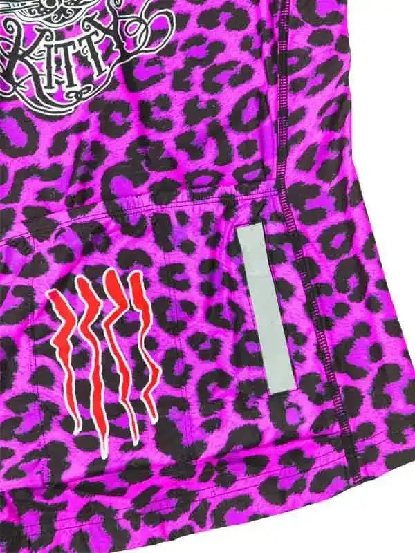 Vibrant purple leopard print cycling jersey with bold graphic design and reflective strip
