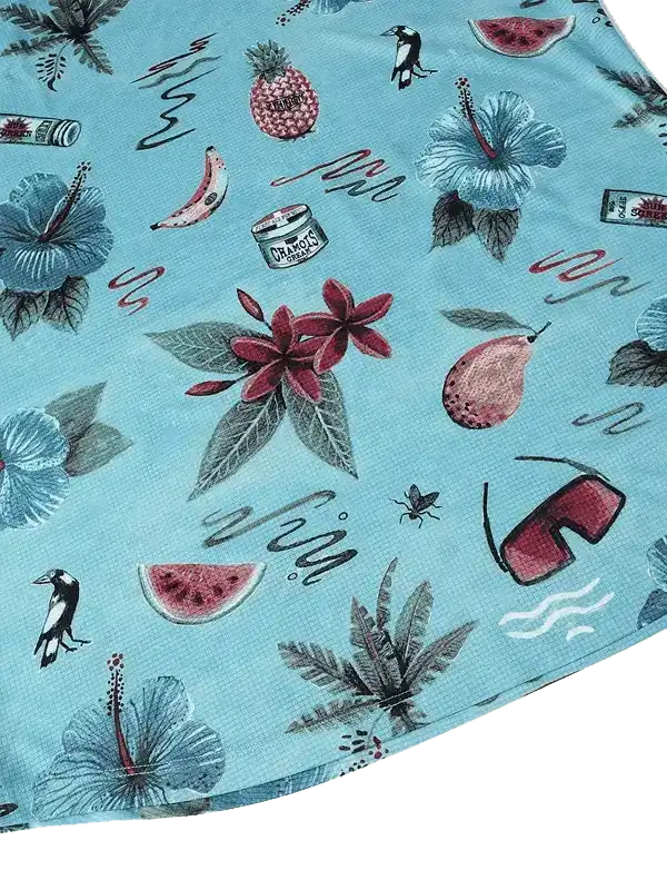 Tropical print cycling jersey with hibiscus, fruit, and birds on light blue fabric