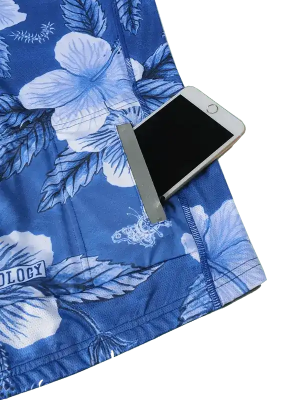 Blue floral cycling shorts with phone pocket, featuring hibiscus print and secure storage for rides