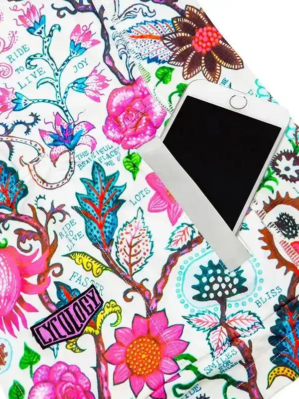 Vibrant floral cycling apparel with 'Ride to Live' print, featuring phone pocket and colorful botanical design.