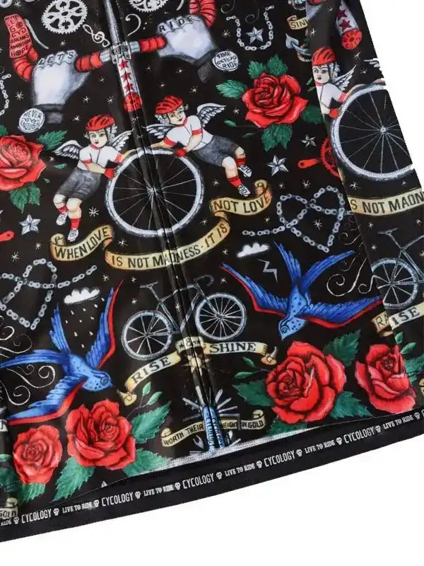 Men's cycling jersey with bold tattoo-style print featuring roses, angels, bikes, and motivational phrases on black fabric.