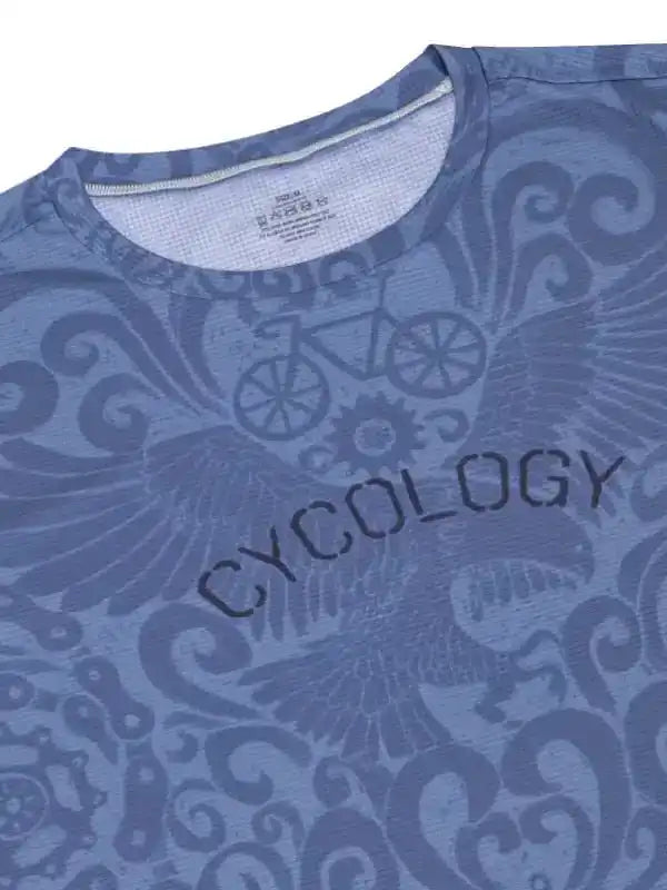 Blue cycling jersey with 'CYCOLOGY' text and bike gear pattern, featuring unique design for men's and women's cycling apparel.