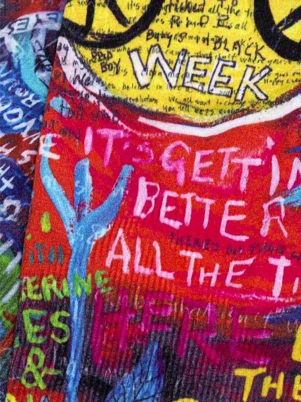 Vibrant cycling jersey with bold graffiti-style text and colorful graphics, perfect for men's and women's rides.