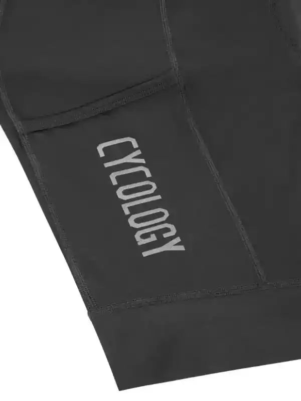 Black cycling shorts with Cycology logo, featuring rear storage pocket and performance stitching