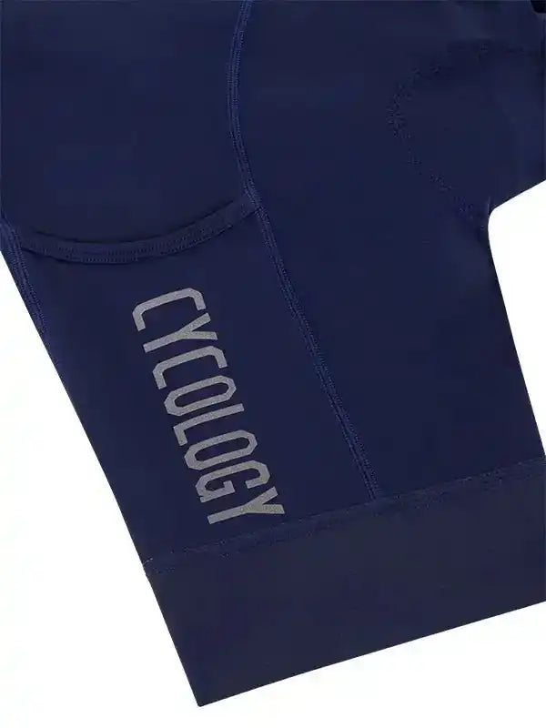 Navy blue cycling shorts with 'CYCOLOGY' logo, featuring padded design for comfort during rides.