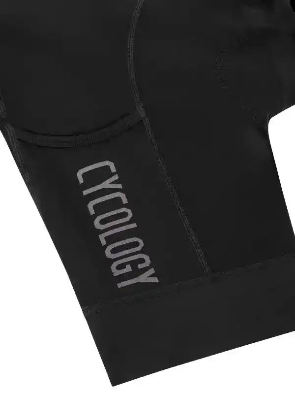 Black cycling shorts with 'CYCOLOGY' logo, high-quality fabric for men's and women's bike wear