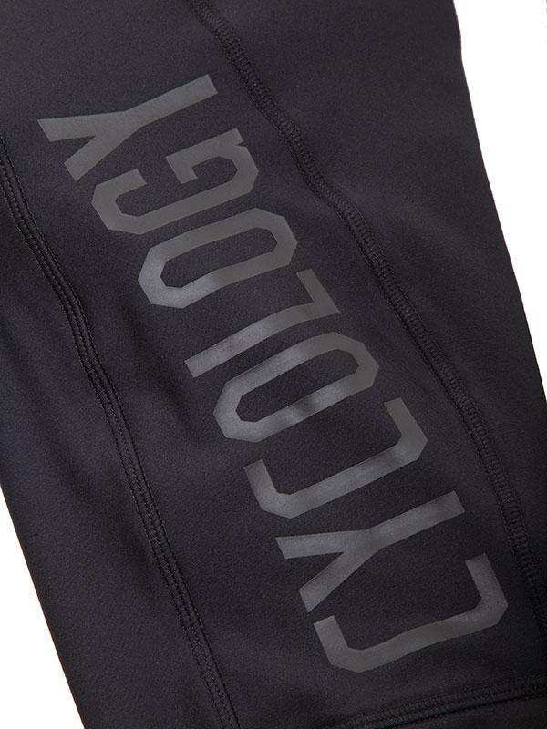 Black cycling pants with bold 'CYCOLOGY' logo, high-performance fabric for men's and women's bike wear