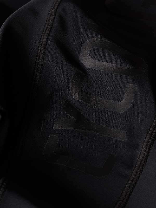 Black cycling jersey with subtle 'CYCO' logo, high-quality fabric detail
