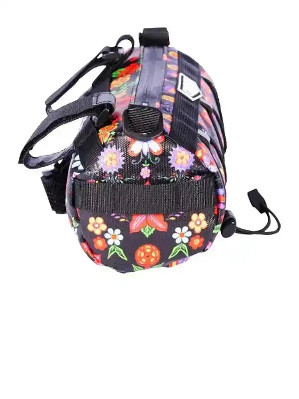 Floral pattern cycling saddle bag with black straps and zipper, ideal for bike rides and outdoor adventures.