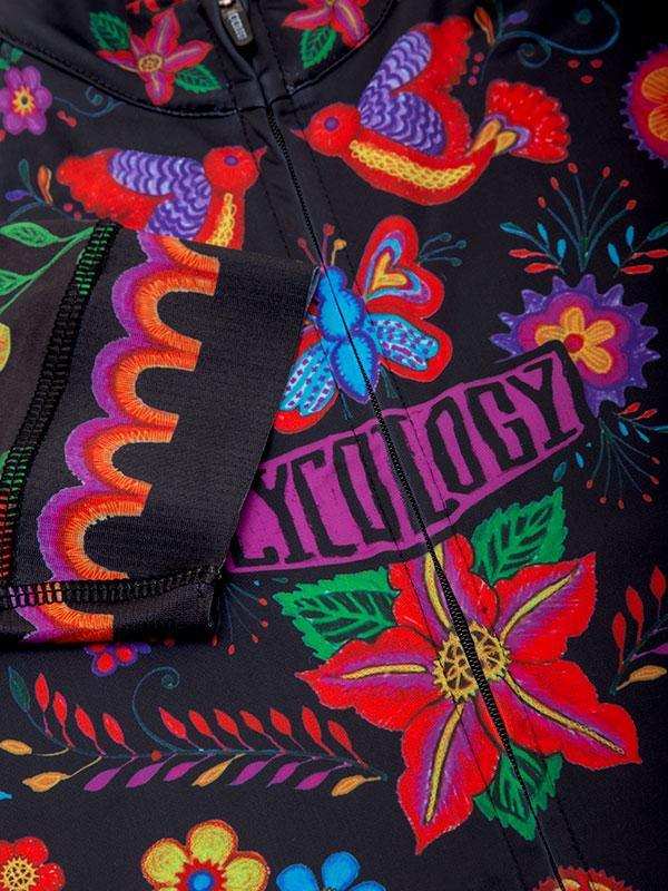 Vibrant floral and bird pattern cycling jersey with bold colors and 'CYCOLOGY' logo