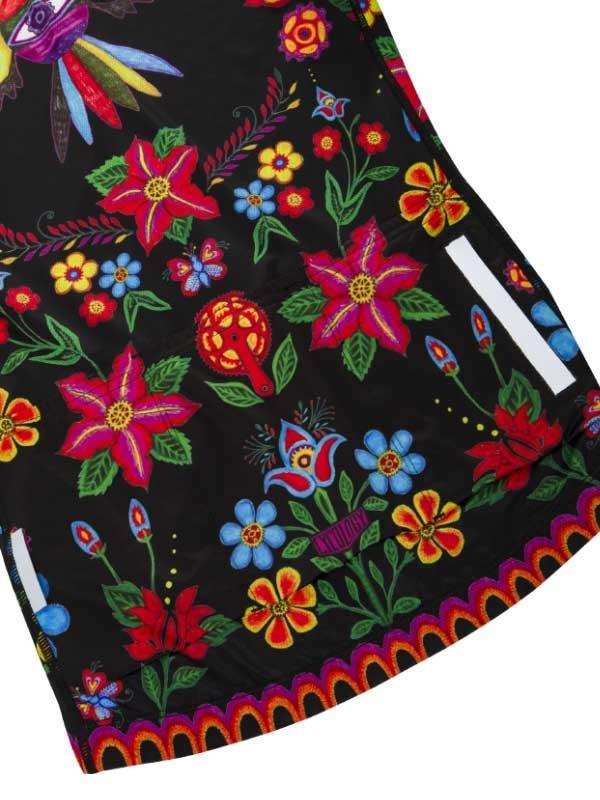Vibrant floral cycling jersey with colorful flowers, butterflies, and folk art patterns on black fabric