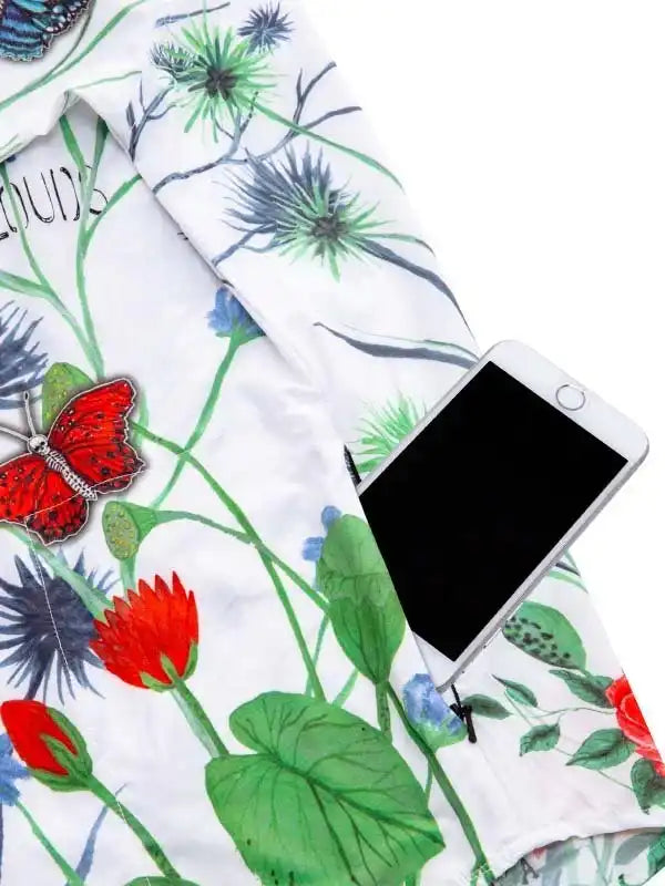 Floral cycling jersey with red butterfly print, green leaves, and phone pocket for riders