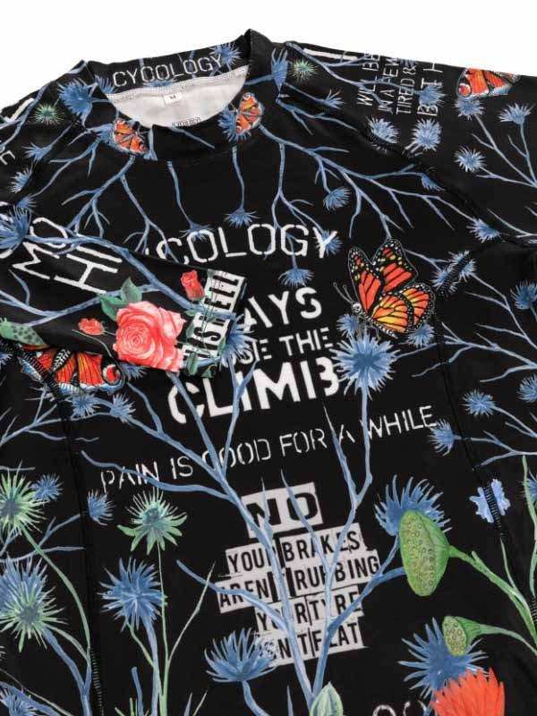 Black cycling jersey with floral and butterfly print, motivational text, and 'Cycology' branding