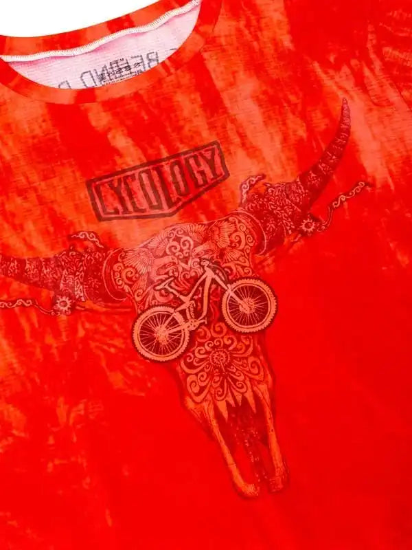 Red tie-dye cycling shirt with ornate bull skull and bike graphic, featuring 'Cycology' logo