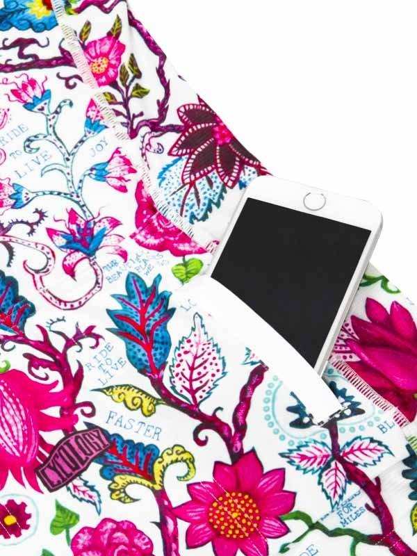 Floral cycling shorts with phone pocket, vibrant pink blue print, ride faster design